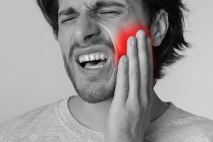 man with jaw pain