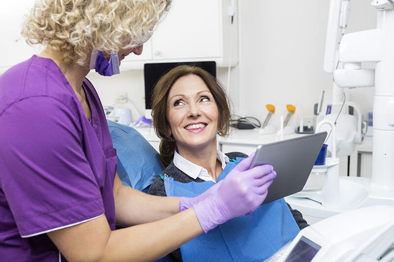 woman seeing her x-rays at the dental office