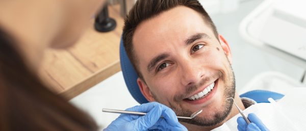 man geting a dental exam